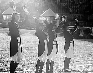 The gold medal winning German team greets their fans during the prize giving ceremony in the setting sun