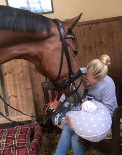 Jessica von Bredow-Werndl showing baby Moritz to her Grand Prix horse Zaire E