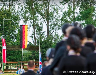 The flags are hoisted for the national anthem