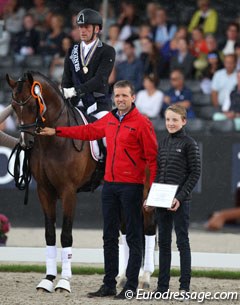 Jan Christensen and Hesselhoj Donkey Boy win bronze. Breeder Hans Jürgen Hoeck by their side