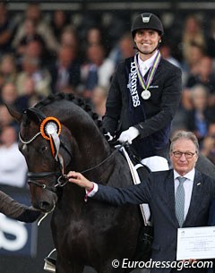 Andreas Helgstrand and Ferrari win silver, show director and FEI Dressage Committee chair Frank Kemperman flanks them