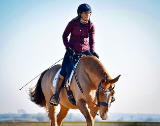 Anna Ross at Elite Dressage in Devon giving Newton Domino a pat :: Photo © Verona Thomas