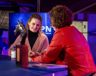 Jasmijn van der Velden picks up the Jazz Trofee which her late grand father Joop Rodenburg received for breeding the 2020 KWPN Horse of the Year, Glamourdale :: Photo © Dirk Caremans