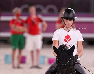Carina Cassoe Kruth at the 2021 Olympics. She brought her own trainer Andreas Helgstrand to Tokyo. On this photo Kyra Kyrklynd and Danish team trainer Nathalie zu Sayn-Wittgenstein are watching her schooling session :: Photo © Astrid Appels