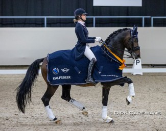 Dinja van Liere and Hermes decorated with the 2021 KWPN Horse of the Year sash :: Photo © Dirk Caremans