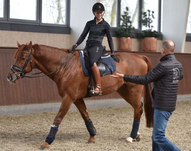 Agnete Kirk Thinggaard on Blue Hors Veneziano with coach Lars Petersen by her side :: Photo © Ridehesten
