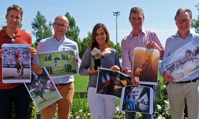 The jury holding seven of the best photos for the 2019 Silver Camera Award