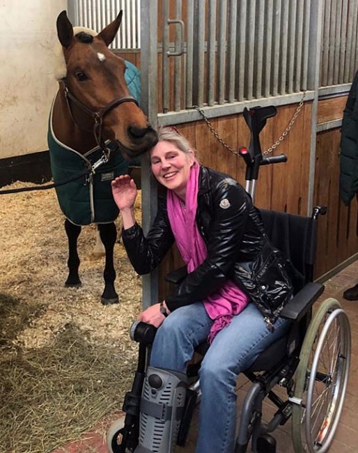 Esther Maruhn, sidelined with a fractured ankle, getting cuddles from Va'Pensiero