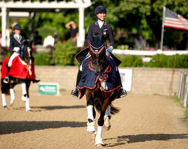 Laura Graves and Sensation HW in their lap of honour at the 2022 U.S. Dressage Championships :: Photo © Sue Stickle