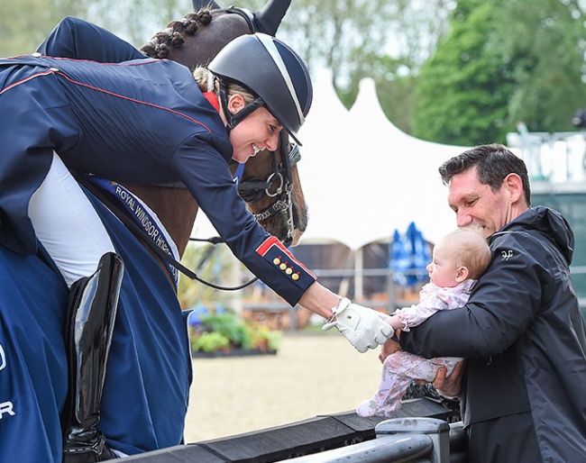 Three weeks in the saddle and back to winning: Charlotte Dujardin with daughter Isabella at the 2023 CDI Windsor :: Photo © Peter Nixon