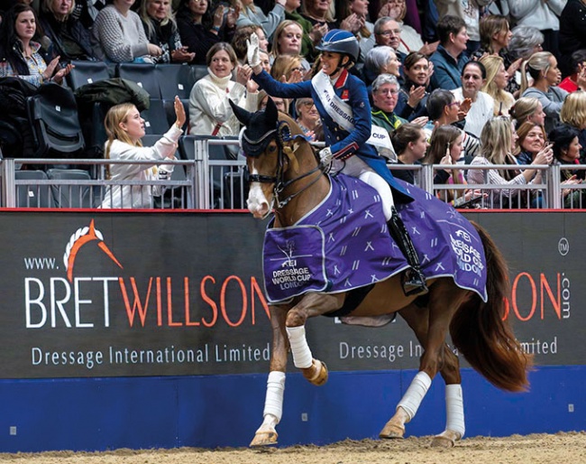 Dujardin high-fives with a fan in her lap of honour at the 2023 CDI-W London :: Photos © Jon Stroud