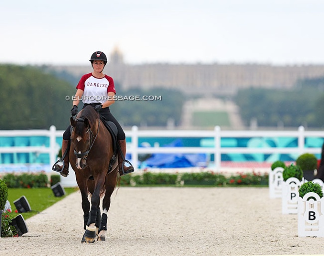 Nadja Aaboe Sloth walks Favour Gersdorf round the competition arena at the 2024 Olympics :: Photo (c) Astrid Appels