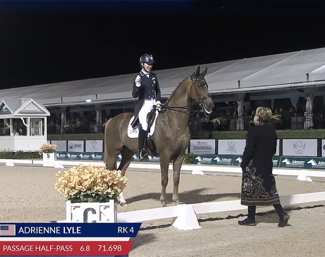 Adrienne Lyle indicating to the judge at C that her music was off half way through her freestyle test