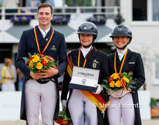 Frederic Wandres, Isabell Werth, Charlott Maria Schurmann on the podium after the GPS at the 2026 German Championships :: Photo © Stefan Lafrentz